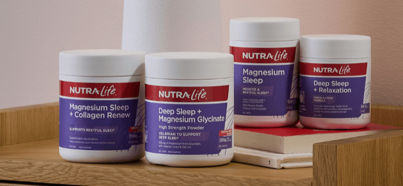 Nutra Life sleep supplement containers on a wooden surface with a neutral background